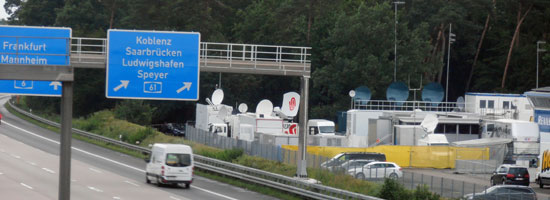 The  Tripple Dish trailer and other uplinks seen from the Autobahn 6 at Hockenheim, Germany